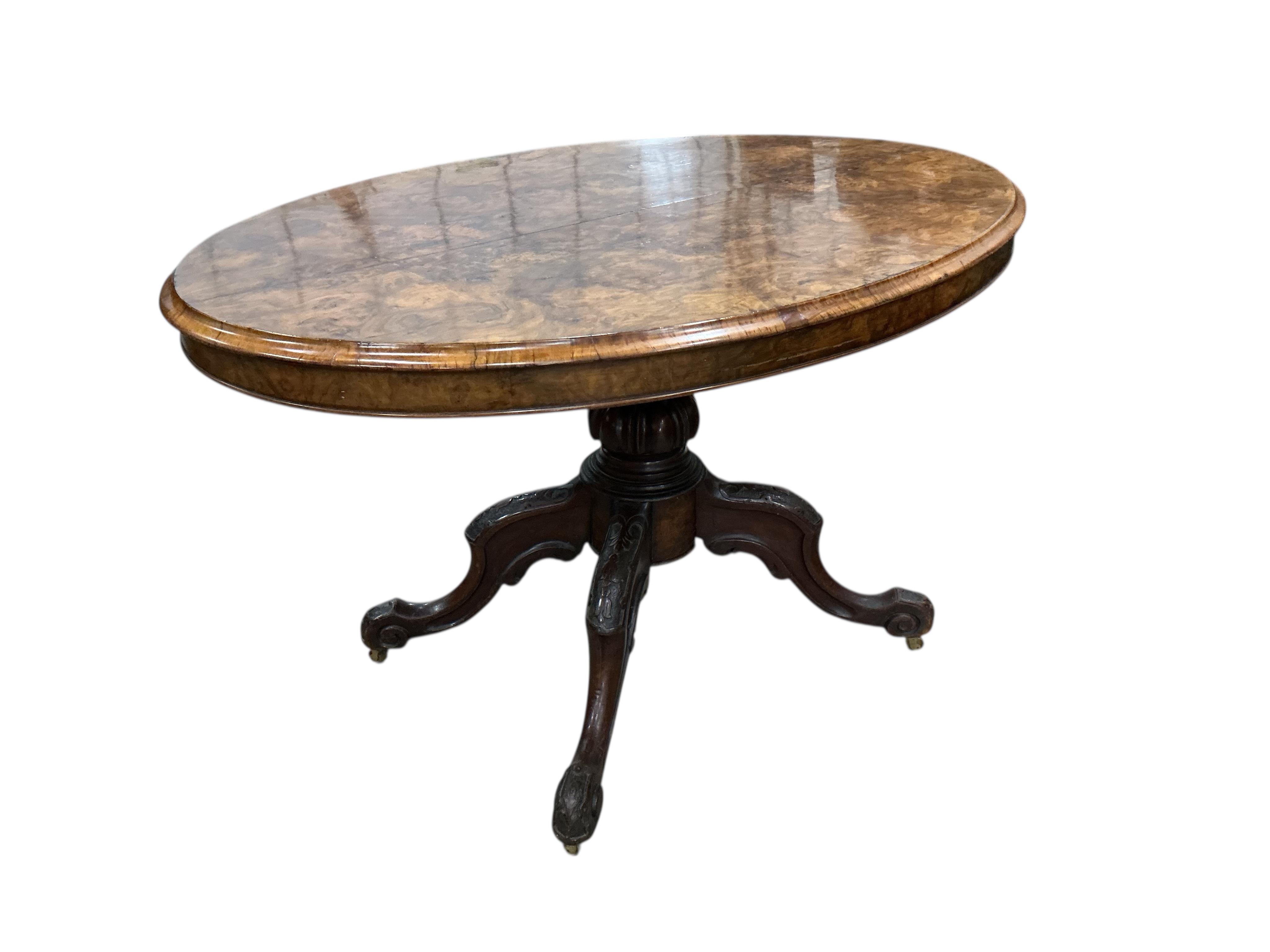 A Victorian figured walnut oval tilt top loo table, width 84cm, depth 122cm, height 72cm